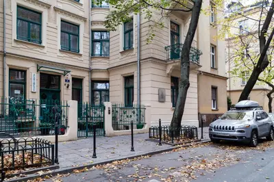 a car parked in front of a building at Househost Apartment: Bonerowska 5/11 in Kraków