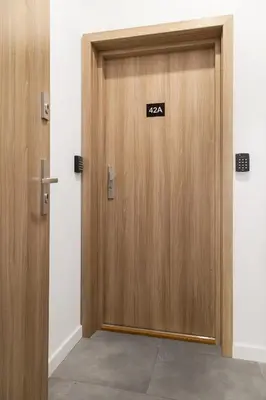 a door with a sign that reads zaz on it at HOUSEHOST Apartament: ul. Miodowa 42/42a in Kraków