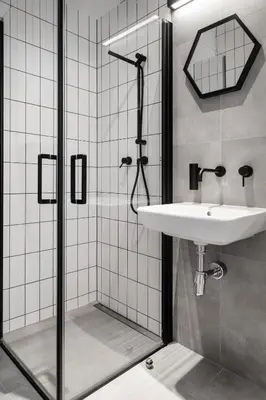 a bathroom with a sink and a shower at HOUSEHOST Apartament: ul. Miodowa 42/42a in Kraków