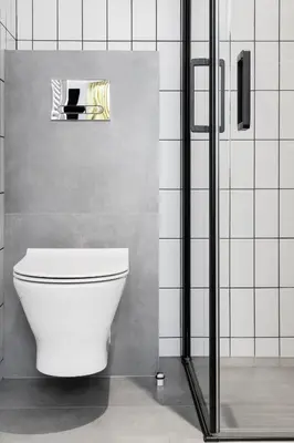 a bathroom with a white toilet in a room at HOUSEHOST Apartament: ul. Miodowa 42/42a in Kraków
