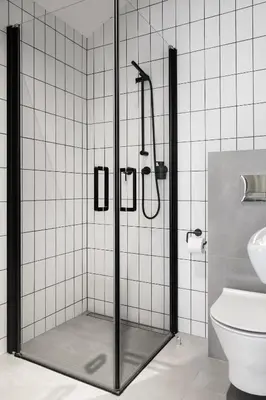 a shower stall in a bathroom with a toilet at HOUSEHOST Apartament: ul. Miodowa 42/42b in Kraków