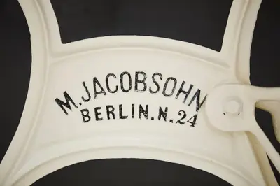 a white bike wheel with the word macrocognitive at HOUSEHOST Apartment: Józefa Dietla 73/7 in Kraków