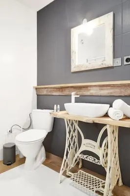 a bathroom with a sink and a toilet at HOUSEHOST Apartment: Józefa Dietla 73/7 in Kraków