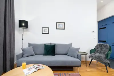 a living room with a couch and a table at Sweet Family Apartment Chodkiewicza Rondo Grzegórzeckie by Noclegi Renters in Kraków