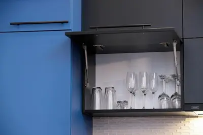 a cabinet with wine glasses in it at Sweet Family Apartment Chodkiewicza Rondo Grzegórzeckie by Noclegi Renters in Kraków