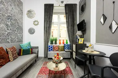 a living room with a couch and a table at Native Apartments Studencka 25 in Kraków