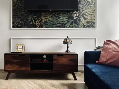 a living room with a table and a couch at Monkeyland - unique apartment in Old Podgorze in Kraków