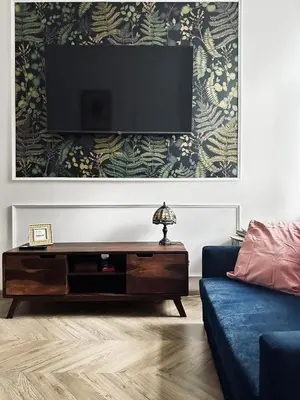 a living room with a flat screen tv on a wall at Monkeyland - unique apartment in Old Podgorze in Kraków