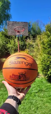 a person holding a basketball in front of a hoop at Pod Magnolią in Targanice