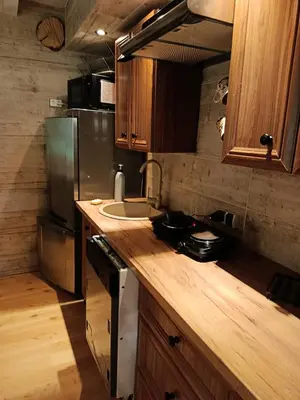 a kitchen with a sink and a refrigerator at Pod Magnolią in Targanice