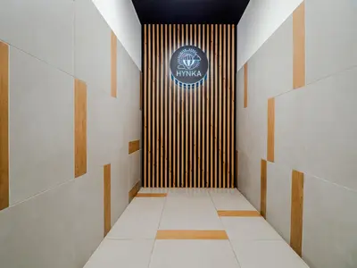 a hallway with a sign on the wall in a building at Miły czas in Kraków