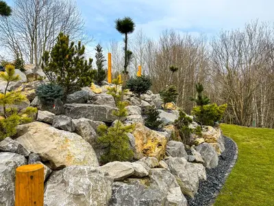 a rock garden with a bunch of rocks at Babiogórskie Stodoły in Zawoja