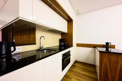 a kitchen with a sink and a counter at Native Apartments Masarska 8/5 in Kraków