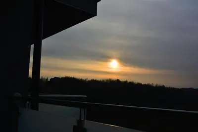 a view of the sunset from a cruise ship at Apartament na wynajem 32 m2 in Bochnia