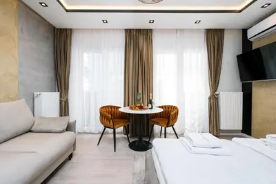a living room with a couch and a table at Salomea apartments Kraków, Stary Kazimierz, Tauron arena in Kraków