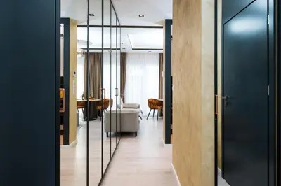 a hallway with glass doors and a living room at Salomea apartments Kraków, Stary Kazimierz, Tauron arena in Kraków