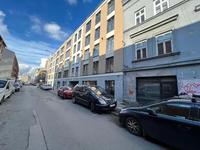 a street with cars parked on the side of a building at Salomea apartments Kraków, Stary Kazimierz, Tauron arena in Kraków