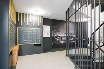 a hallway with black walls and a staircase at Salomea apartments Kraków, Stary Kazimierz, Tauron arena in Kraków