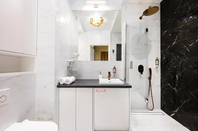 a white bathroom with a sink and a shower at Salomea apartments Kraków, Stary Kazimierz, Tauron arena in Kraków