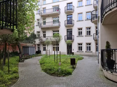 an apartment building with a courtyard in front of it at Old Town WAWEL Premium Apartment - 60m2 in Kraków