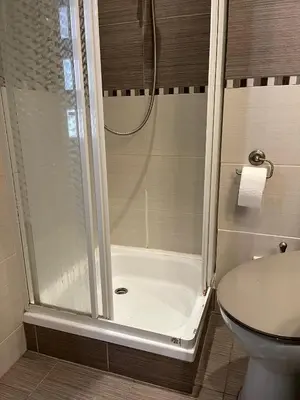a bathroom with a shower and a toilet at Room in Old Town Krakow in Kraków