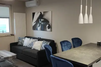 a living room with a couch and a table at Nowoczesny apartament w pobliżu centrum in Kraków
