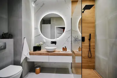 a bathroom with a sink and a mirror at Przytulny Apartament Greenwall in Kraków