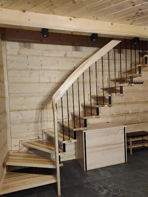 a wooden staircase in a room with wooden walls at beskid house in Spytkowice