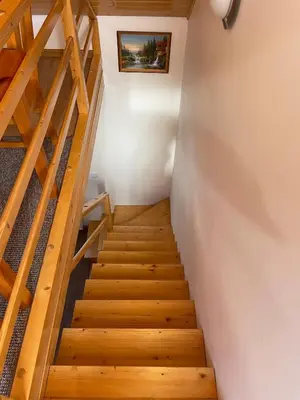 a staircase in a house with wooden floors at U Pająka in Wieprzec