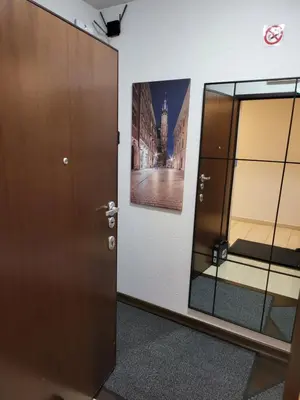 a room with a door and a picture on the wall at AMBER APARTAMENt 519 in Kraków