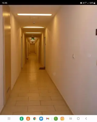 a long hallway with a long hallwayngth at AMBER APARTAMENt 519 in Kraków