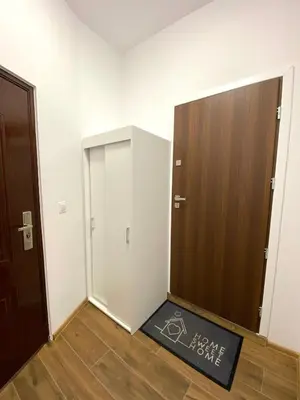 an empty room with a door and a door mat at Apartament z jacuzzi in Kraków