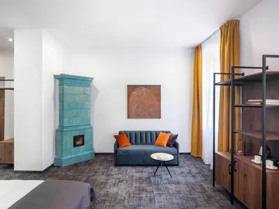 a living room with a couch and a fireplace at Old Market Residence in Kraków