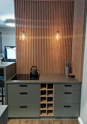 an office with a desk with wine bottles at Apartament Raciborska 1 in Kraków