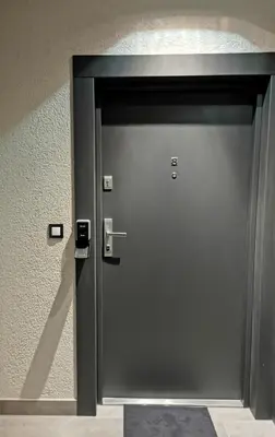 a metal door in a building with at Apartament Raciborska 1 in Kraków