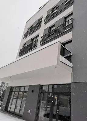 a large building with a balcony on top of it at Apartament Raciborska 1 in Kraków