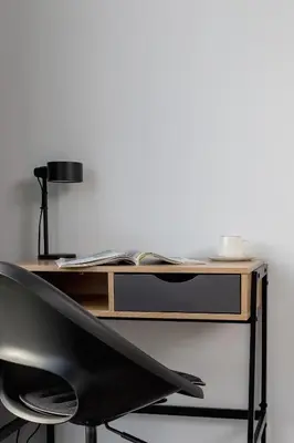 a desk with a chair and a lamp on it at Świtezianki Luxurious Apartments with Parking by Renters Prestige in Kraków