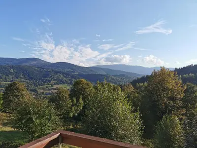 a view of a valley with trees and mountains at Domek na Niedźwiedziarce in Zawoja