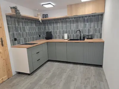 a kitchen with a sink and a counter top at Domek na Niedźwiedziarce in Zawoja