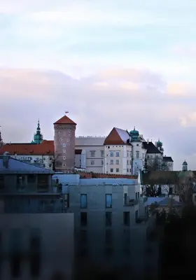 a view of a city with buildings and water at Wawel View Apartment in Kraków
