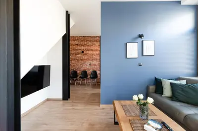 a living room with a couch and a table at NEO UNIQUE & BRIGHT Apartments, FREE PARKING, 15min Old Town & Kazimierz - by Homelike Krakow in Kraków