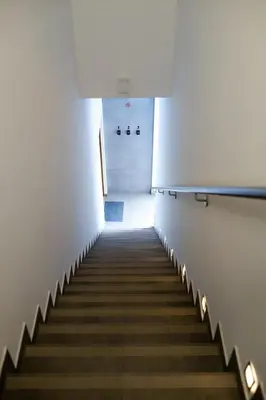 a staircase in an office building with a hallway at NEO SKY Apartment, FREE PARKING, 15 min walk Old Town&Kazimierz - by Homelike Krakow in Kraków