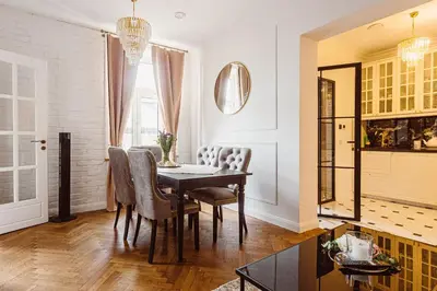 a dining room with a table and chairs at Glamour Old Town Blich Kraków in Kraków