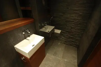 a bathroom with a sink and a toilet at Modern & Resto Apartments in Kraków