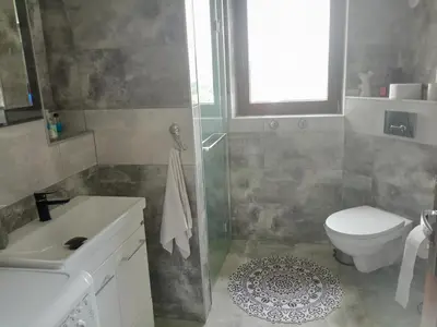 a bathroom with a shower and a toilet and a sink at POD RÓŻĄ in Kasina Wielka