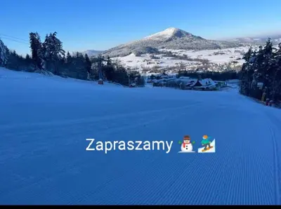 a snowboard in the snow with the word zazermán on it at POD RÓŻĄ in Kasina Wielka