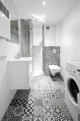 a bathroom with a shower and a washing machine at Room Tour Lubomirskiego 23 in Kraków