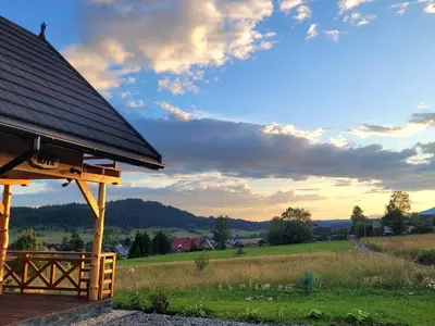 a gazebo with a view of a field at Hamajdówka in Zubrzyca Górna