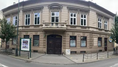 a large building on the corner of a street at Appartement Vieille Ville in Kraków