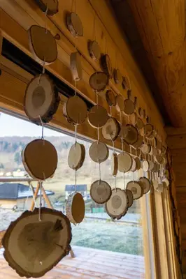 a bunch of pots and pans hanging from a wall at Sielsko Anielsko in Stryszawa